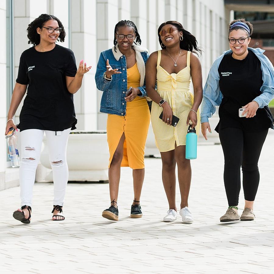 4 Girls walk on plaza